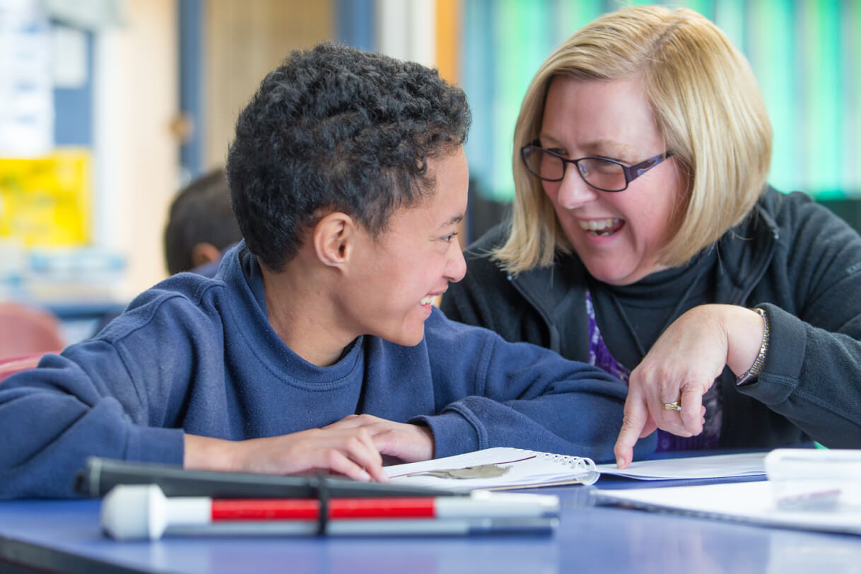 Boston and his RTV Judy sitting at a table.