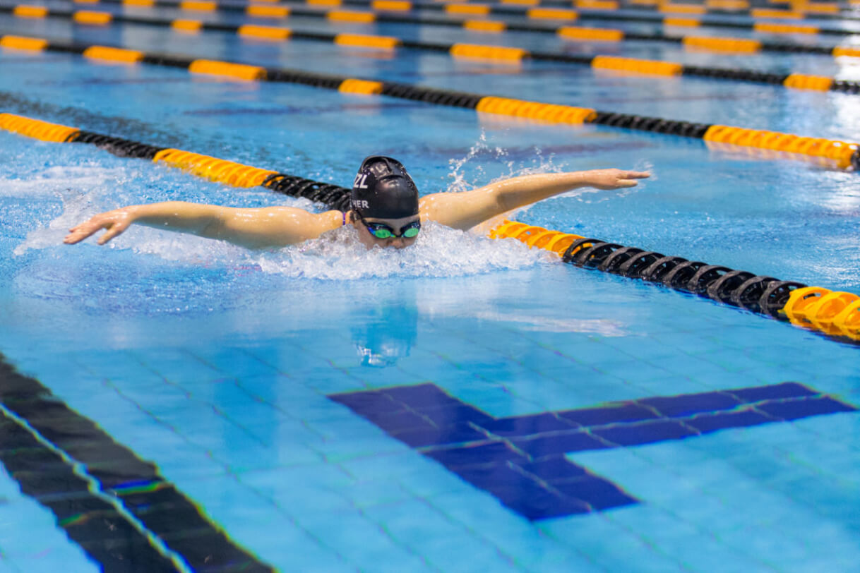 Mary in the pool swimming butterfly.