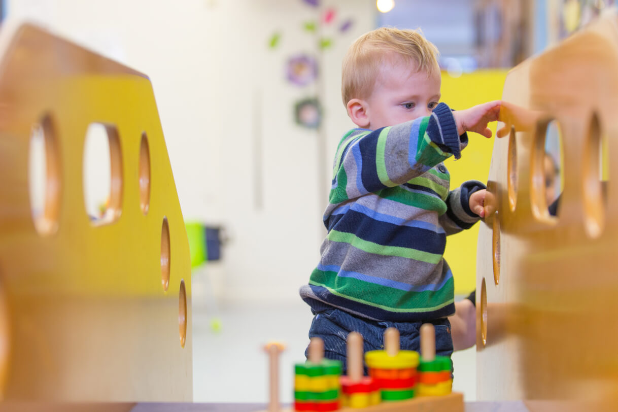 Robert holds on to the rail with both hands.