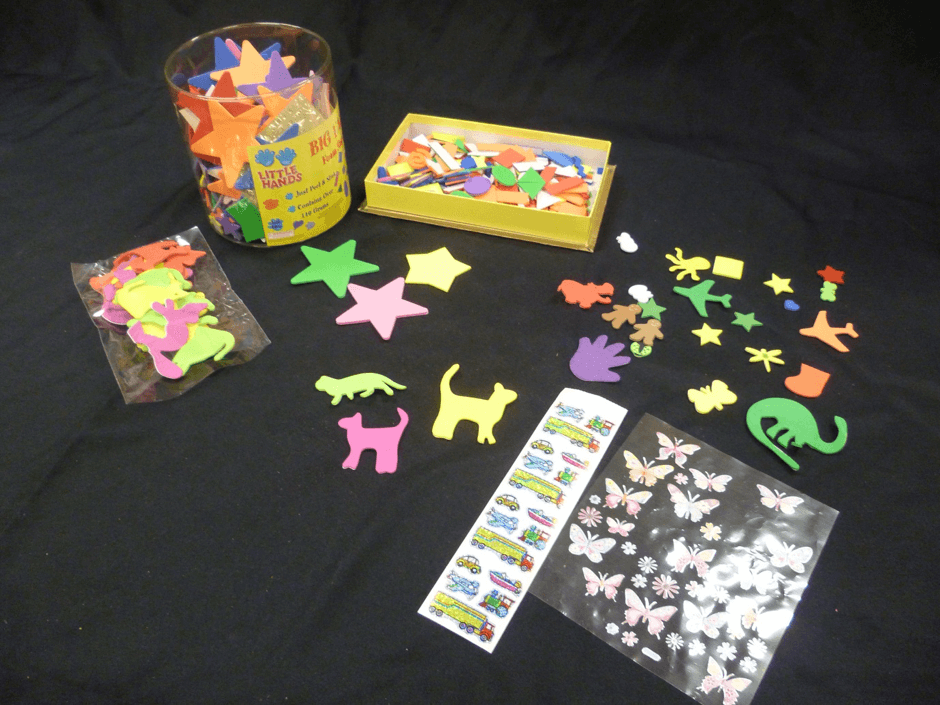 A range of commercially produced stickers in a variety of shape, textures and thicknesses.